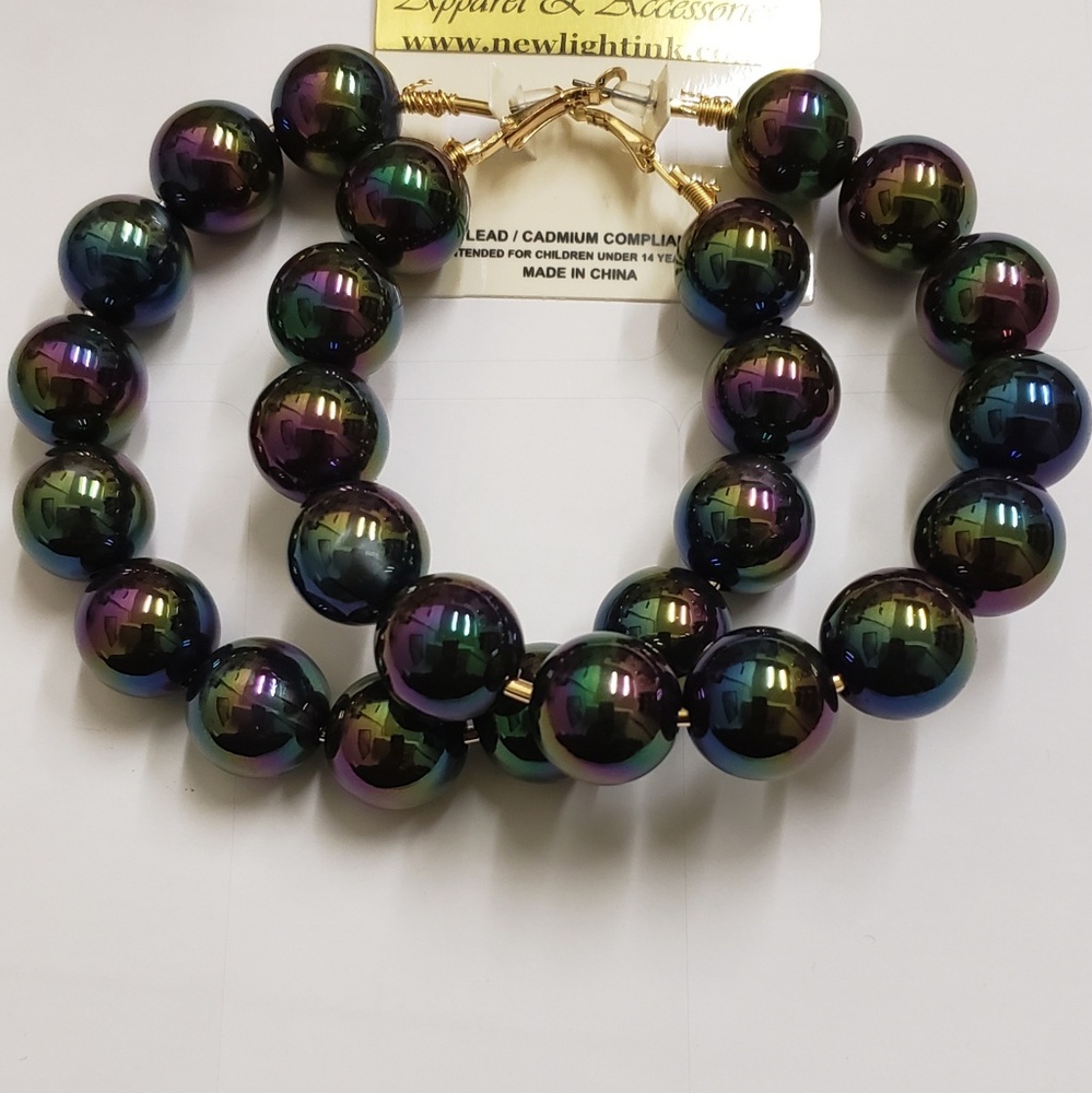 Earrings by: New light ink Apparel and Accessories